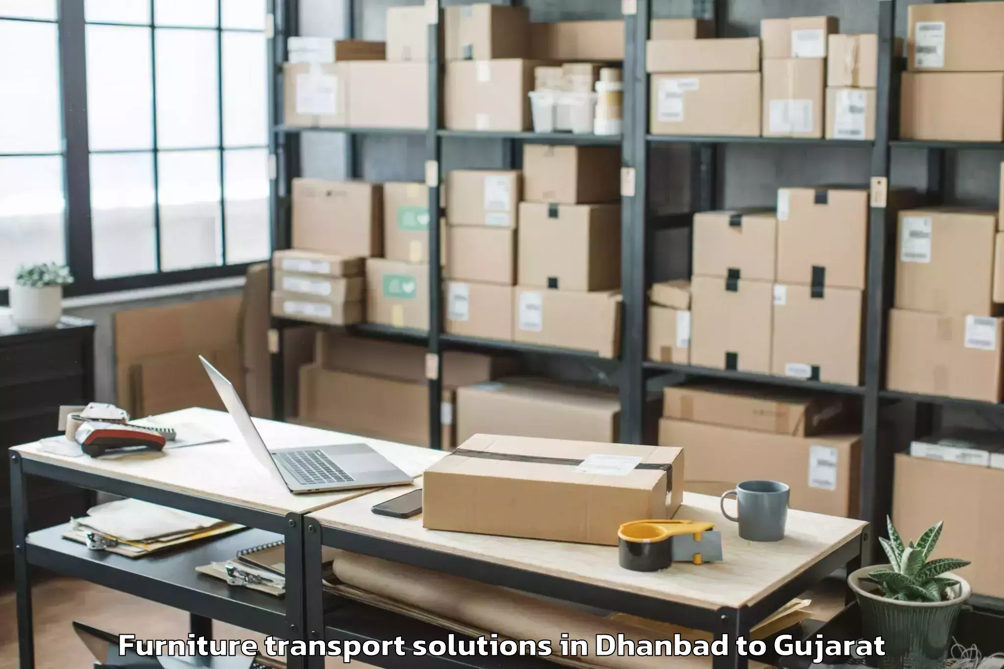 Get Dhanbad to Vaghodia Ina Furniture Transport Solutions